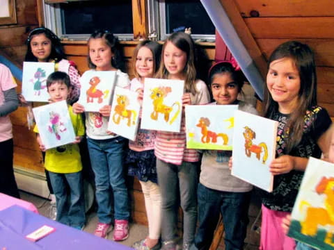 a group of children holding up signs