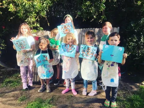 a group of children holding signs