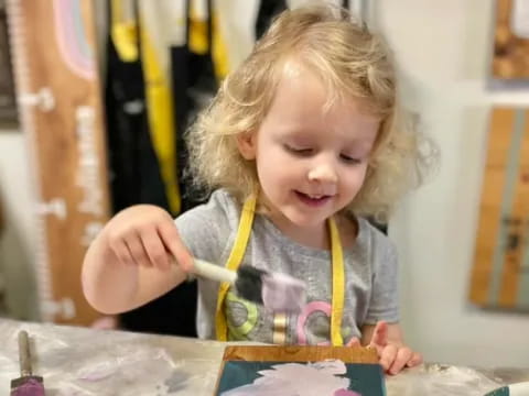 a young girl painting