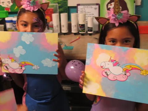 a couple of girls holding books