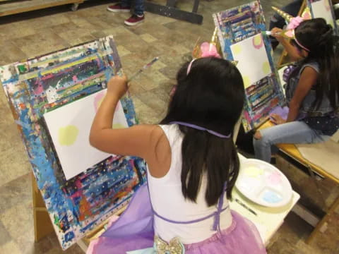 a group of girls painting