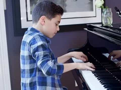 a man playing a piano