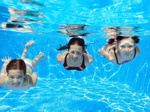 a group of people swimming