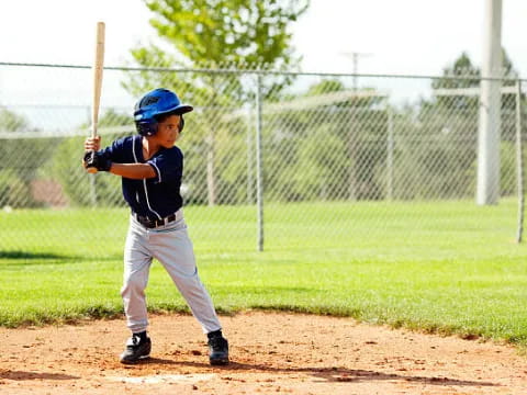 a young boy playing baseball