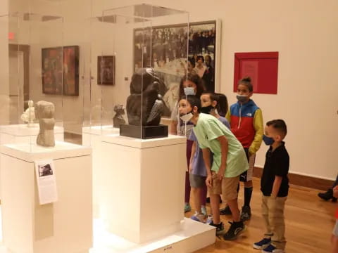 a group of people standing in a museum