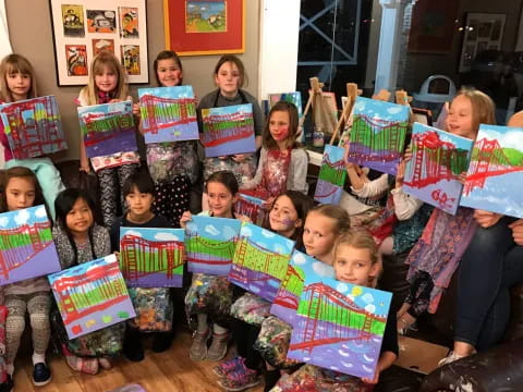 a group of children holding up colorful flags