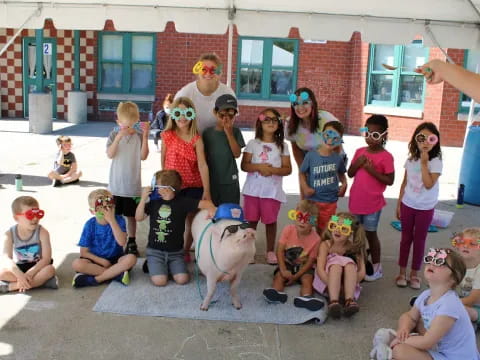 a group of people posing for a photo with a dog