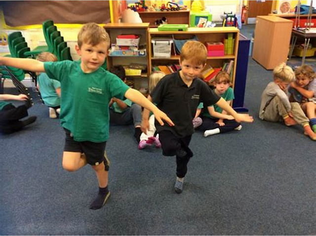 a couple of boys playing with a toy