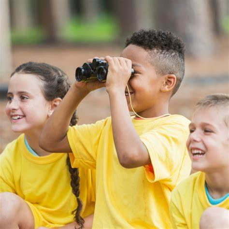 a group of children in yellow shirts