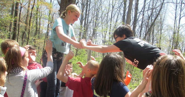 a group of people in a forest