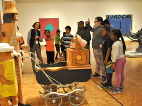 a group of people standing in a room with a skeleton and a skeleton