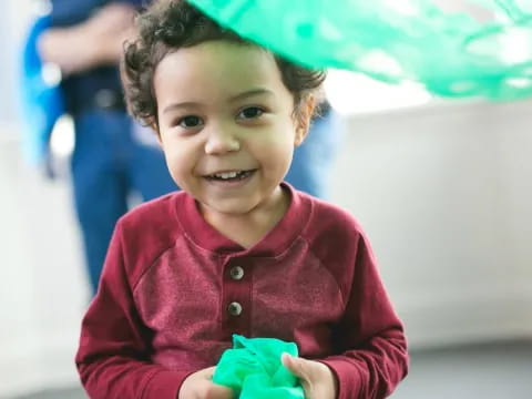 a child holding an umbrella