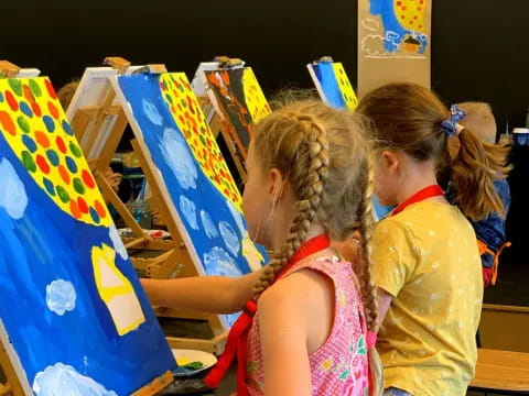 a group of girls painting