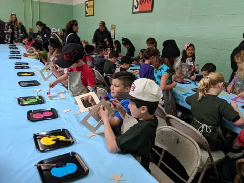 a group of children sitting at a table