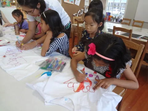 a group of children painting