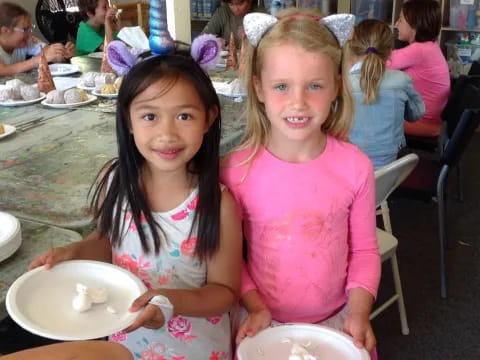 two girls sitting at a table