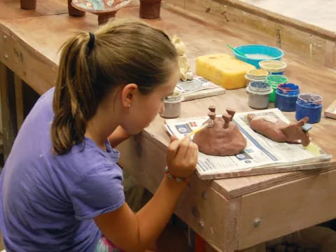 a young girl painting