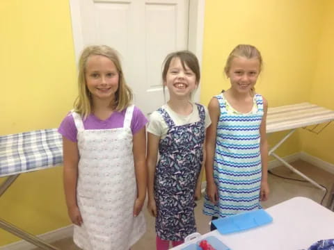 a group of girls in dresses