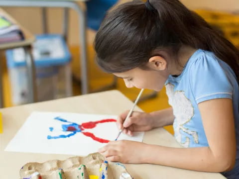 a young girl painting