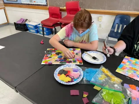 a person painting on a table