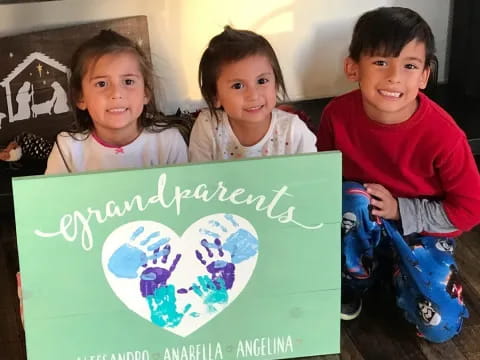 a group of children holding a sign