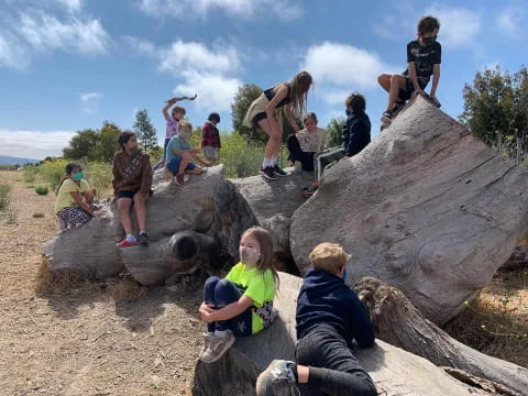 a group of people on rocks