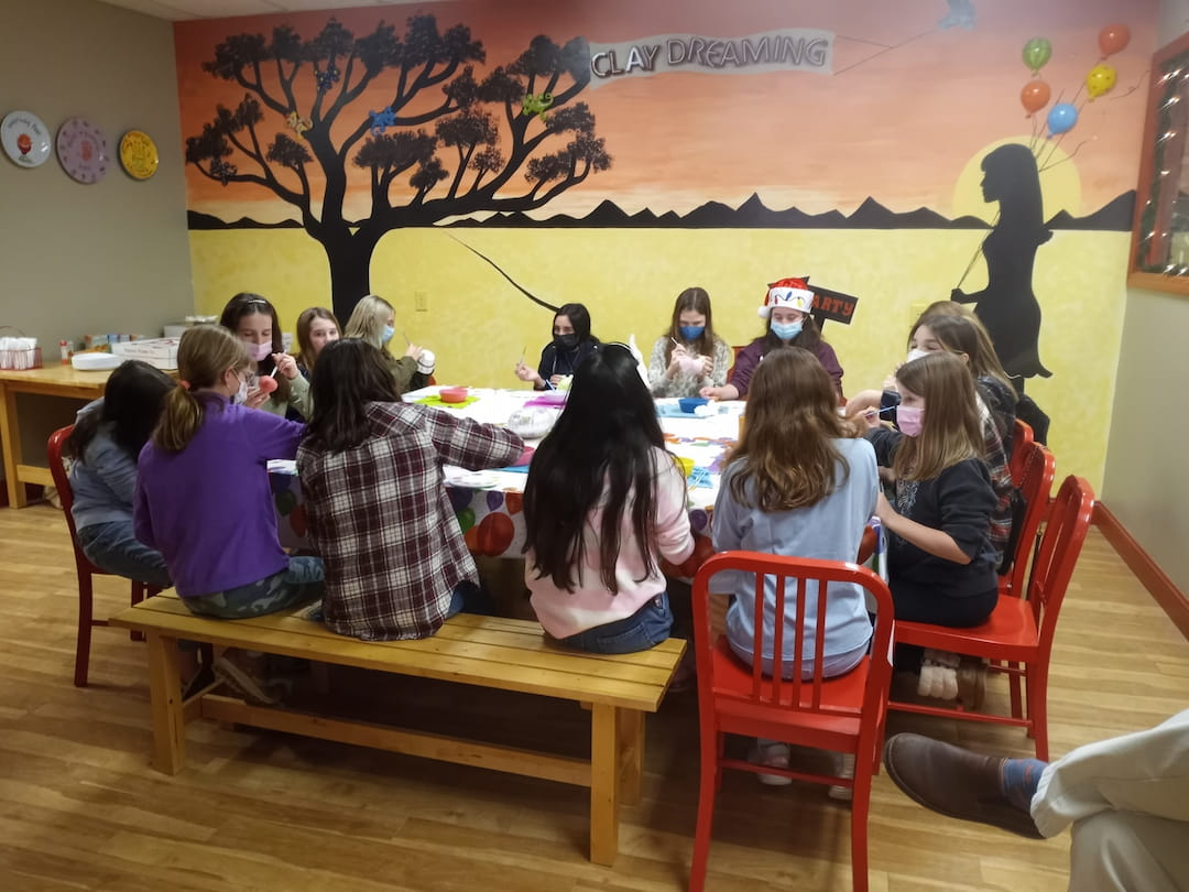 a group of people sitting at a table