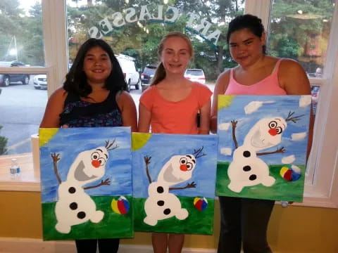 a group of women holding a picture