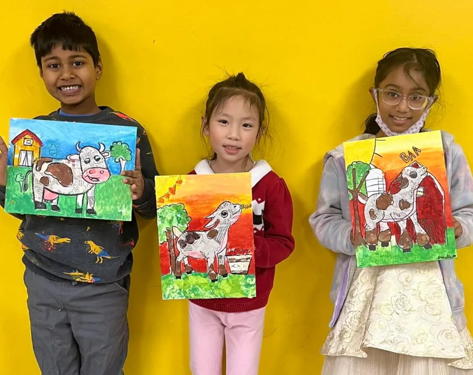 a group of children holding books