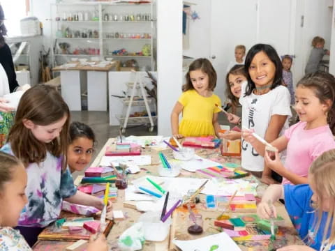 a group of children sitting at a table