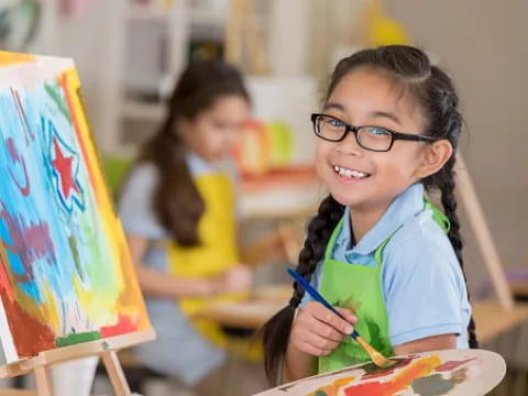 a young girl painting