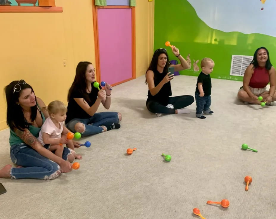 a group of people playing with toys