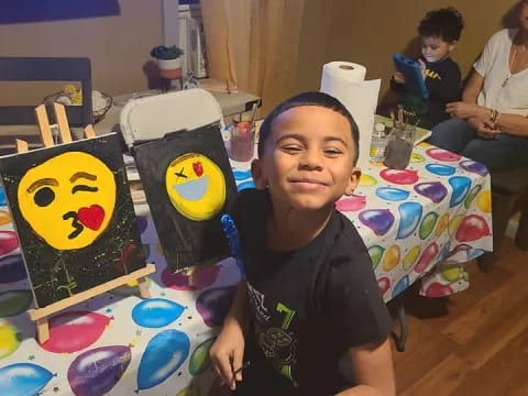 a boy sitting at a table