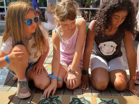 a group of children sitting on the floor