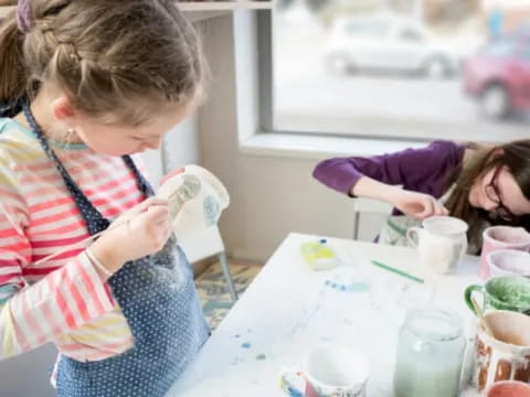 a person painting a child's picture