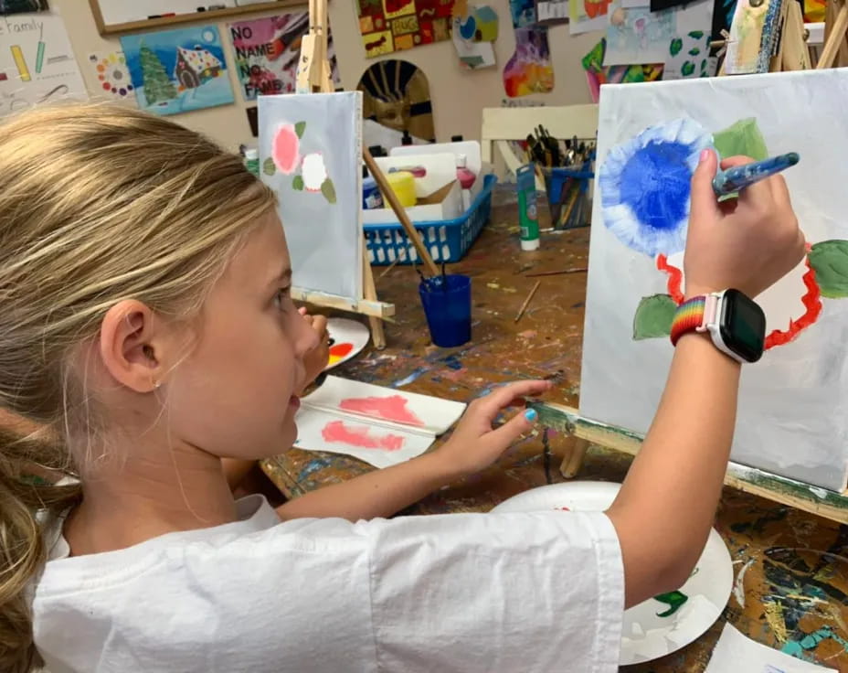 a young girl painting