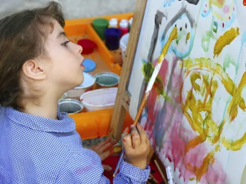 a young girl painting