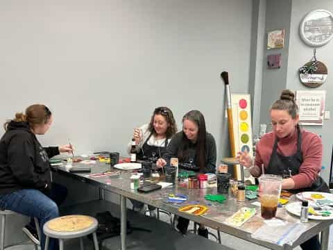 a group of people sitting at a table with drinks