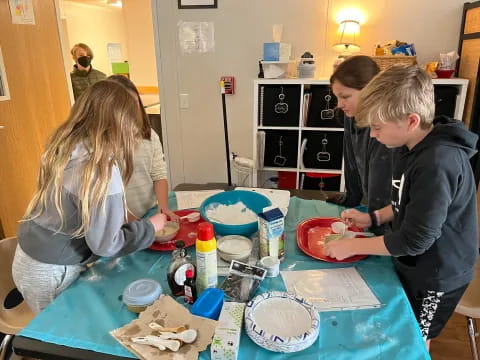 a group of people preparing food