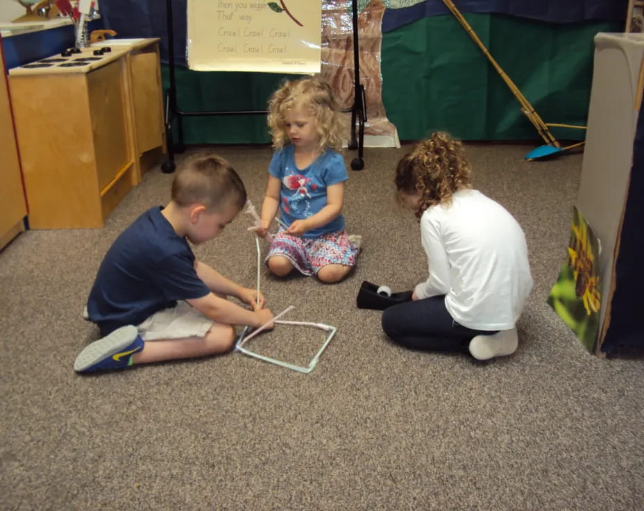 a group of children playing with a toy