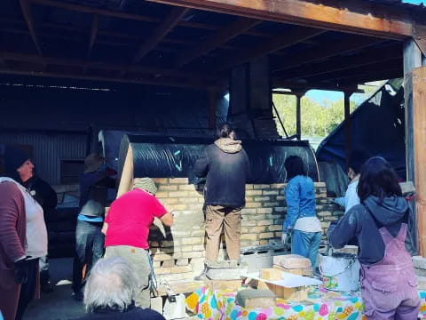 a group of people standing around a person on a trailer