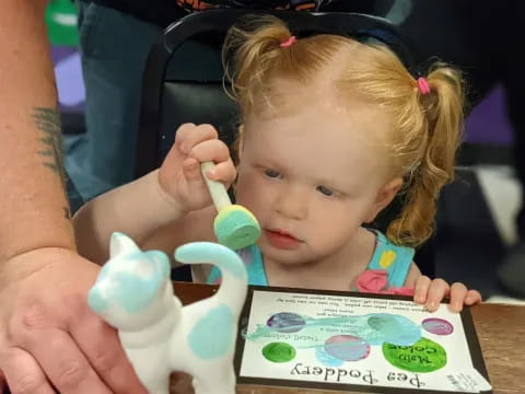 a child brushing her teeth