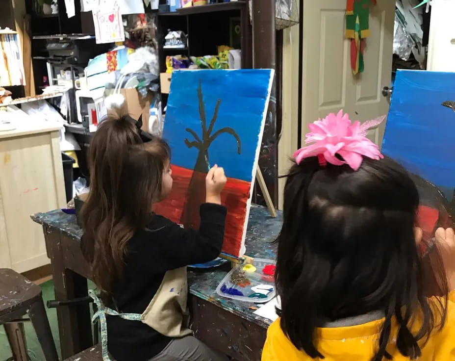 a group of girls painting