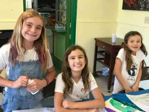 a group of girls smiling