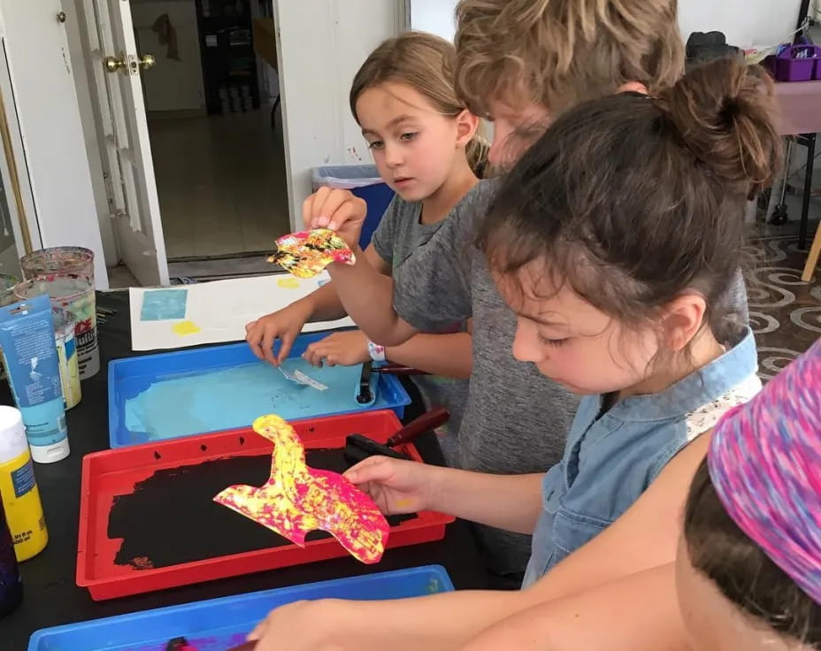 a group of children playing with a toy