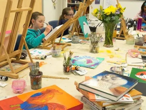 a group of children painting