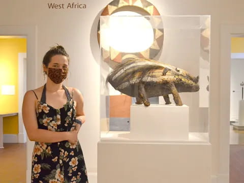 a woman standing in front of a mirror