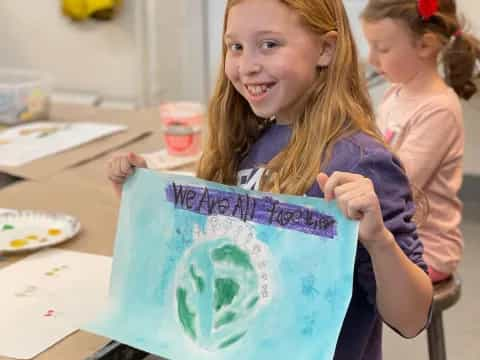 a young girl painting