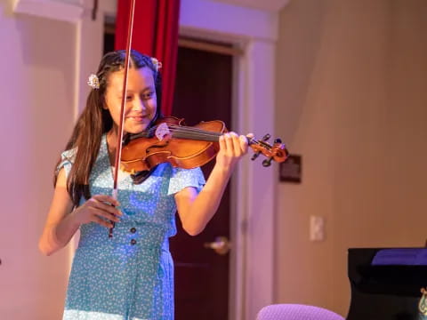 a girl playing a violin