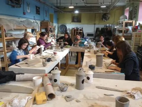 a group of people working in a workshop